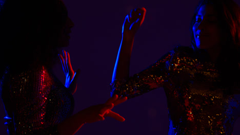 Close-Up-Of-Two-Women-In-Nightclub-Bar-Or-Disco-Dancing-Together-Shot-In-Real-Time
